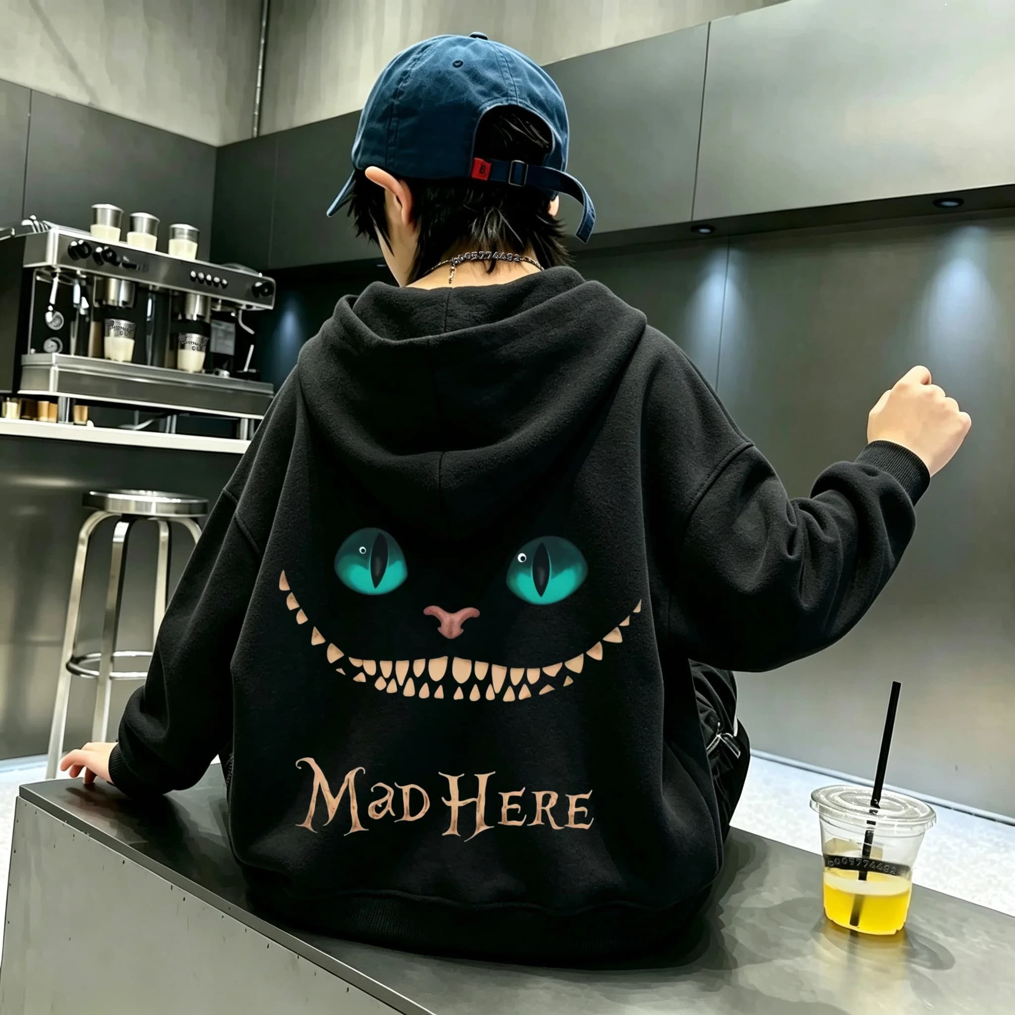 Sweat à capuche pour enfants, tendance et stylé, avec un motif représentant un chaton aux yeux verts