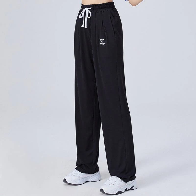 Mode poches élastiques couleur unie épissé pantalons décontractés vêtements pour femmes 2025 printem