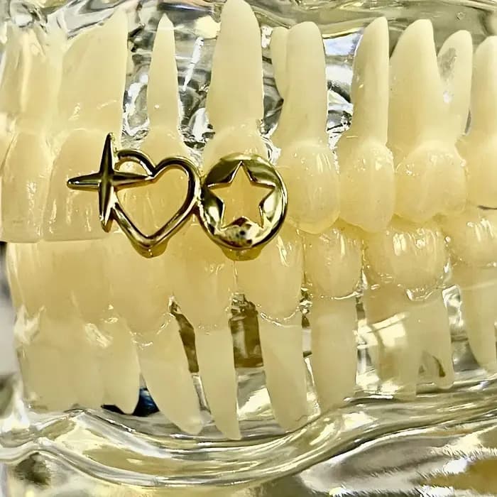 Nouveau coeur creux Hip Hop dent Grillz cuivre coeur forme dents bouchons haute polonais Grills dentaires Hip Hop
