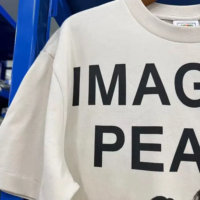 T-shirt décontracté d'été blanc ciment surdimensionné en coton pour hommes, femmes et unisexe, avec impression de slogan Saint IMAGINE PEACE