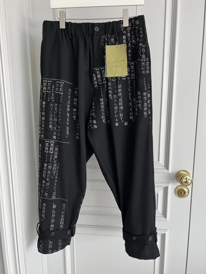 Pantalon décontracté imprimé à décharge de dictionnaire de conception originale TOP-YAMAMOTO avec style défilé en laine