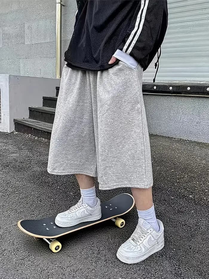 Pantalon unisexe ample style streetwear pour homme, longueur mi-cuisse, idéal pour le skateboard et