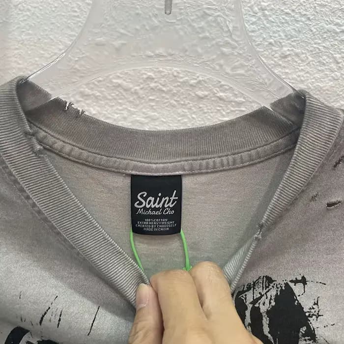 High Street sale endommagé trou dieu est un DJ débardeurs hommes femmes surdimensionné Saint manches-coupées T-Shirt
