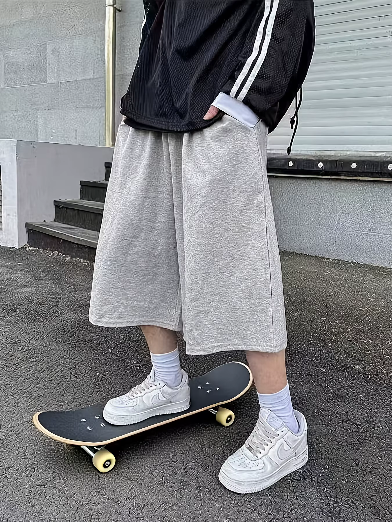 Pantalon unisexe ample style streetwear pour homme, longueur mi-cuisse, idéal pour le skateboard et 